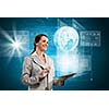 Young businesswoman with tablet pc in hands. Globalization concept