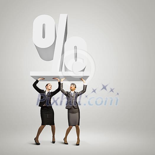 Image of two businesswomen holding percentage symbol above head Image of two businesswomen holding percentage symbol above head