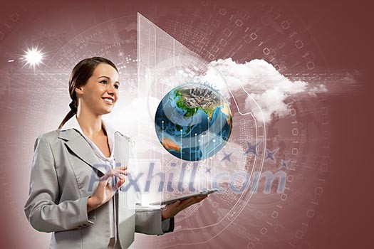 Young businesswoman with tablet pc in hands. Globalization concept. Elements of this image are furnished by NASA Young businesswoman with tablet pc in hands. Globalization concept. Elements of this image are furnished by NASA