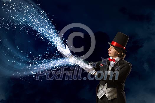 Image of wizard in red bow tie showing tricks Image of wizard in red bow tie showing tricks