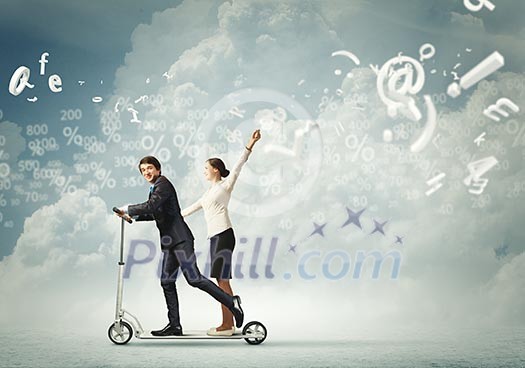 Image of young happy businesspeople riding scooter