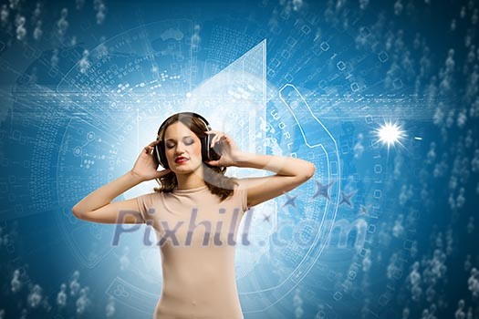 Young girl wearing headphones and listening to music Young girl wearing headphones and listening to music