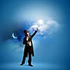 Image of man magician against color background