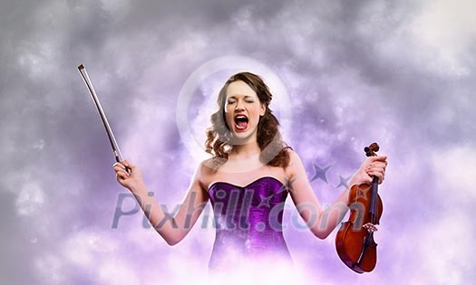 Image of young singing woman holding violin Image of young singing woman holding violin