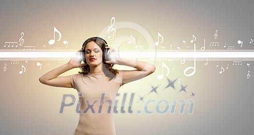 Young girl wearing headphones and listening to music Young girl wearing headphones and listening to music