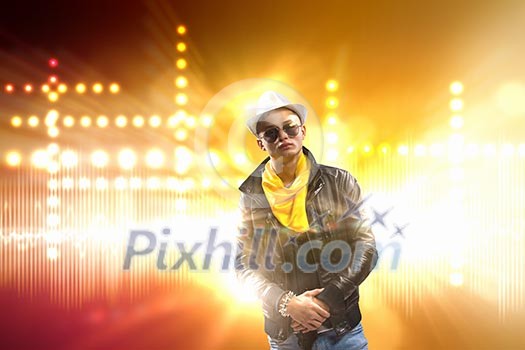 Young man, rock musician in jacket with guitar Young man, rock musician in jacket with guitar