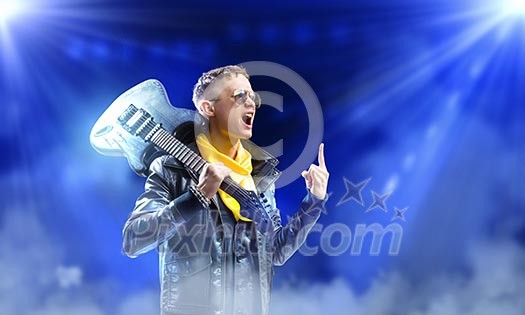 Young man, rock musician in jacket with guitar Young man, rock musician in jacket with guitar