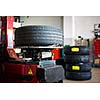 Inside a garage - changing wheels/tires (shallow DOF; color toned image)