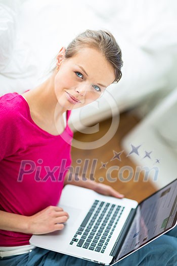 Pretty, young woman working on her laptop computer (shallow DOF; color toned image) Pretty, young woman working on her laptop computer (shallow DOF; color toned image)