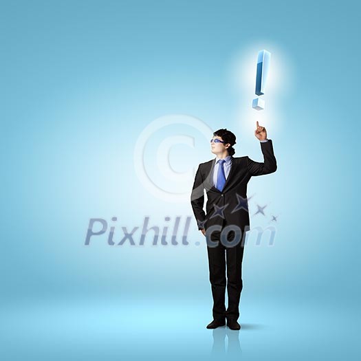 Image of young businessman with exclamation mark Image of young businessman with exclamation mark