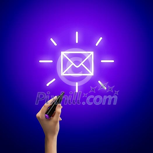 Close up image of human hand drawing envelope Close up image of human hand drawing envelope