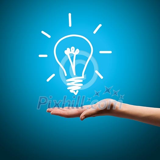 Close up image of human hand with drawn electrical bulb Close up image of human hand with drawn electrical bulb