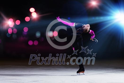 Little girl figure skating at sports arena Little girl figure skating at sports arena