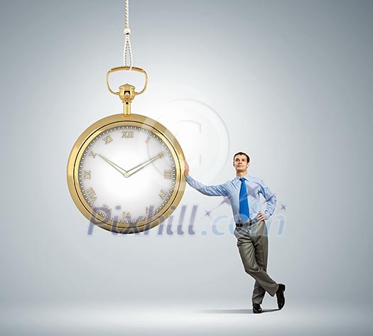 Image of young businessman and pocket watch. Time concept Image of young businessman and pocket watch. Time concept