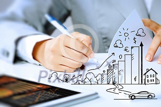 Image of businesswoman sitting at table and drawing sketch Image of businesswoman sitting at table and drawing sketch