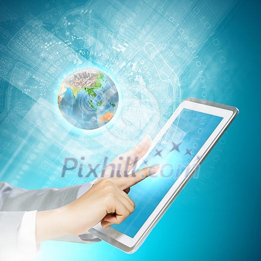 Close up image of human hand touching screen of tablet pc. Elements of this image are furnished by NASA Close up image of human hand touching screen of tablet pc. Elements of this image are furnished by NASA