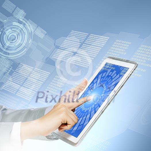 Close up image of human hand touching screen of tablet pc Close up image of human hand touching screen of tablet pc