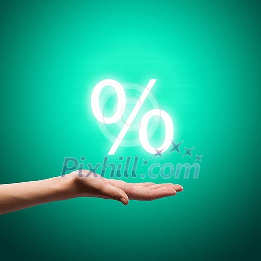 Close up image of human hand holding sales sign Close up image of human hand holding sales sign