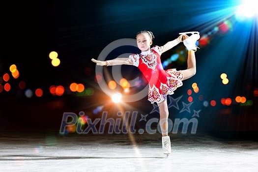 Little girl figure skating at sports arena Little girl figure skating at sports arena