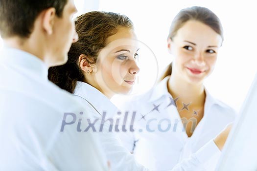 Image of business people at meeting discussing project Image of business people at meeting discussing project