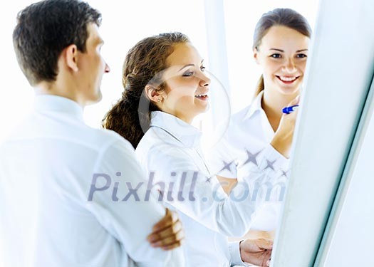Image of business people at meeting discussing project Image of business people at meeting discussing project
