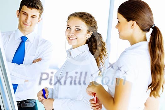 Image of business people at meeting discussing project Image of business people at meeting discussing project
