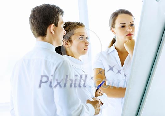 Image of business people at meeting discussing project Image of business people at meeting discussing project