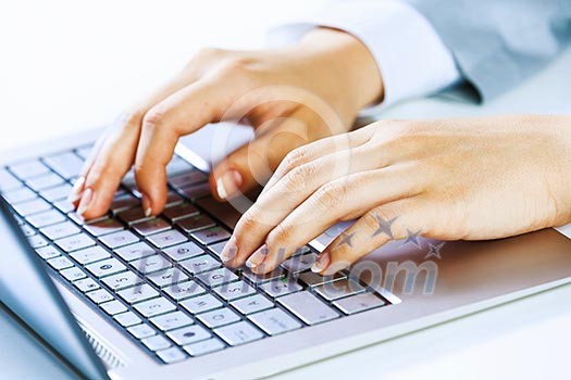 Close up image of businesswoman hands typing on keyboard