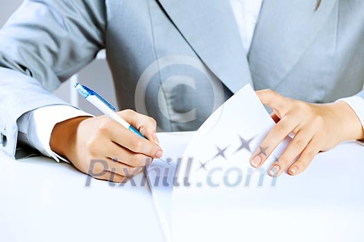 Close up image of businesswoman hands signing documents Close up image of businesswoman hands signing documents