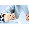 Close up image of businesswoman hands signing documents