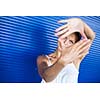 Pretty, young woman making a photo composing/shooting gesture with her hands