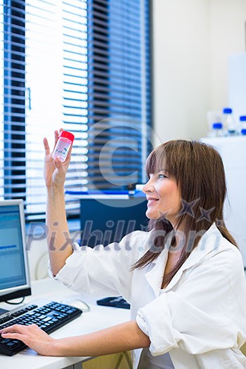 Portrait of a female researcher carrying out research in a chemistry lab (color toned image; shallow DOF) Portrait of a female researcher carrying out research in a chemistry lab (color toned image; shallow DOF)