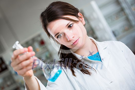 Portrait of a female researcher/chemistry student carrying out research in a chemistry lab (color toned image; shallow DOF) Portrait of a female researcher/chemistry student carrying out research in a chemistry lab (color toned image; shallow DOF)