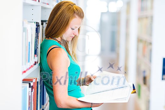 pretty young college student in a library (shallow DOF; color toned image) pretty young college student in a library (shallow DOF; color toned image)