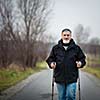 Senior man nordic walking, enjoying the outdoors, the fresh air, getting the necessary exercise