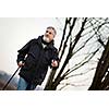 Senior man nordic walking, enjoying the outdoors, the fresh air, getting the necessary exercise