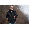 Senior man nordic walking, enjoying the outdoors, the fresh air, getting the necessary exercise