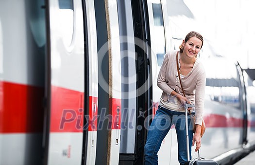 Pretty young woman boarding a train Pretty young woman boarding a train