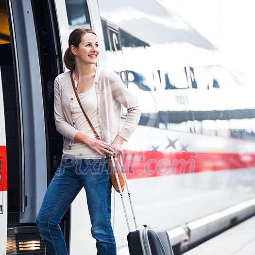 Pretty young woman boarding a train Pretty young woman boarding a train