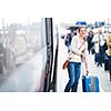Pretty young woman boarding a train