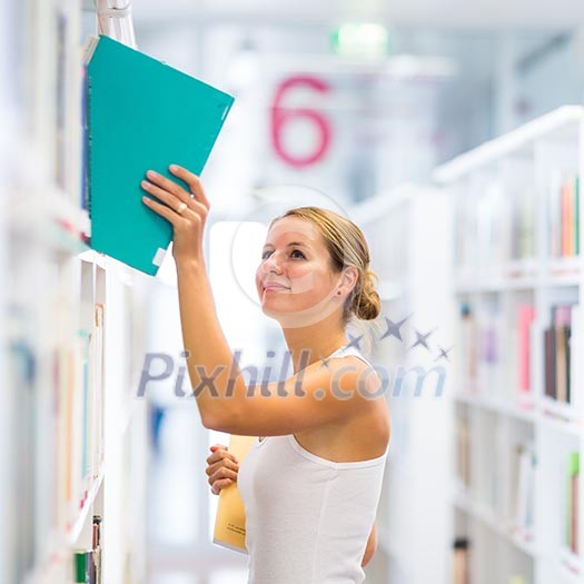 Pretty young college student in a library (shallow DOF; color toned image) Pretty young college student in a library (shallow DOF; color toned image)