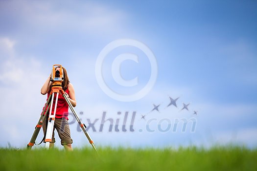Young land surveyor at work Young land surveyor at work