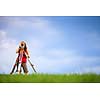 Young land surveyor at work