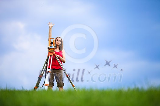 Young land surveyor at work Young land surveyor at work