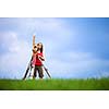 Young land surveyor at work