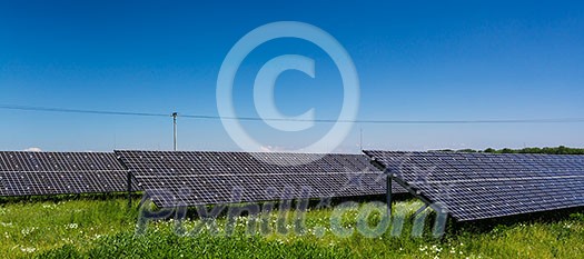Sunlight as a resource of renewable energy: solar panels on a sunny day Sunlight as a resource of renewable energy: solar panels on a sunny day