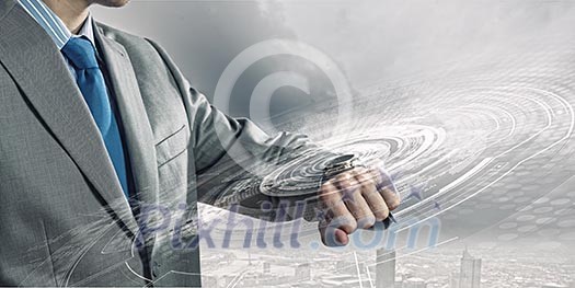 Businessman looking at his watch. New technologies Businessman looking at his watch. New technologies