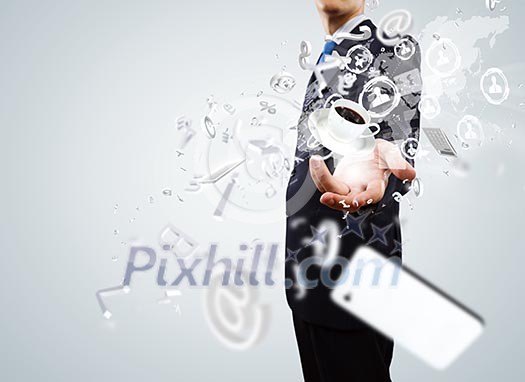 Close up of businessman holding business items in palm Close up of businessman holding business items in palm