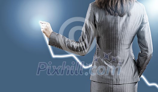 Back view of businesswoman drawing business plan Back view of businesswoman drawing business plan