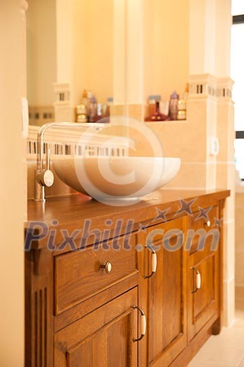 Close-up of a stylish bathroom with wooden theme Close-up of a stylish bathroom with wooden theme